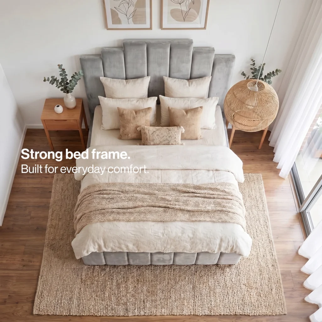 Overhead view of the art deco bed dressed with neutral bedding on a jute rug