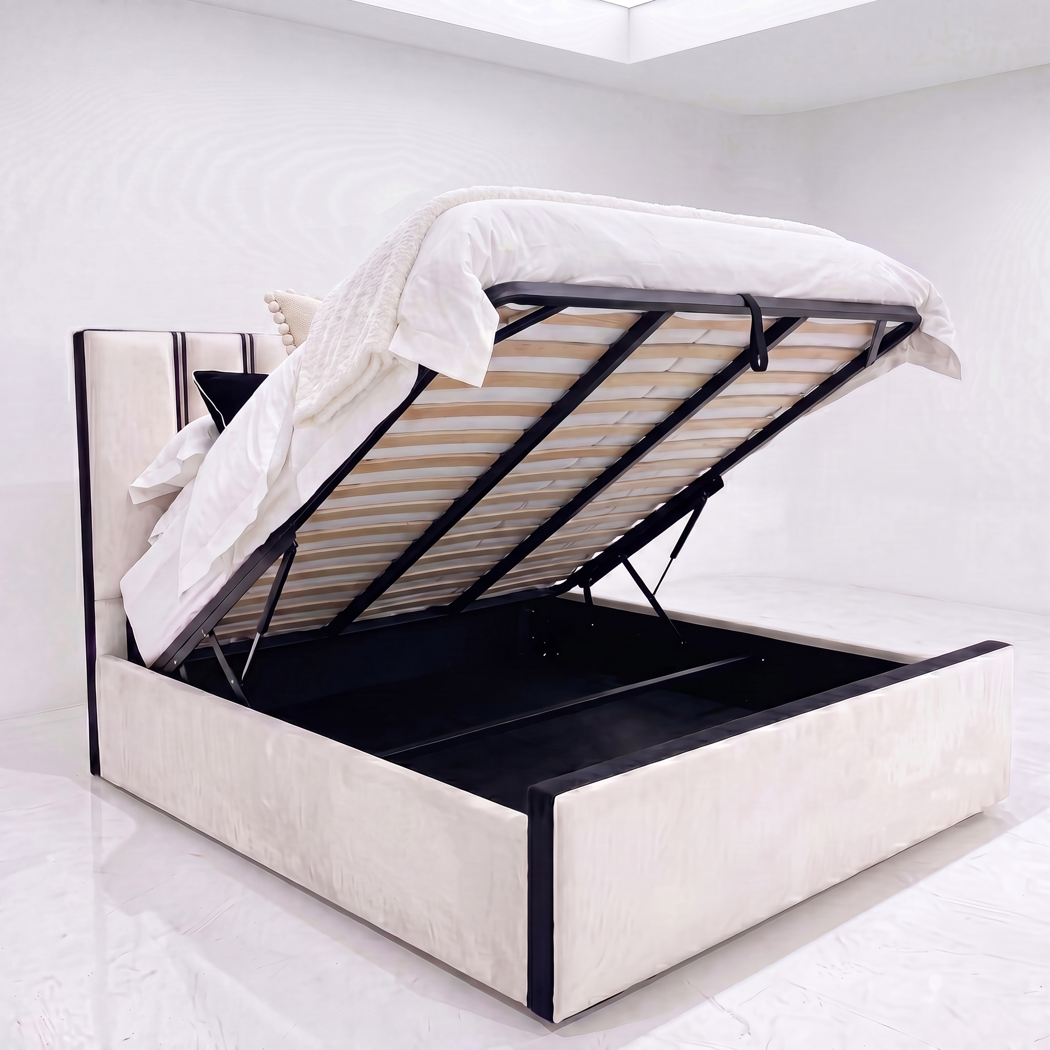 Amalfi ottoman storage bed open on gas-lift pistons showing slatted base and full-width storage compartment