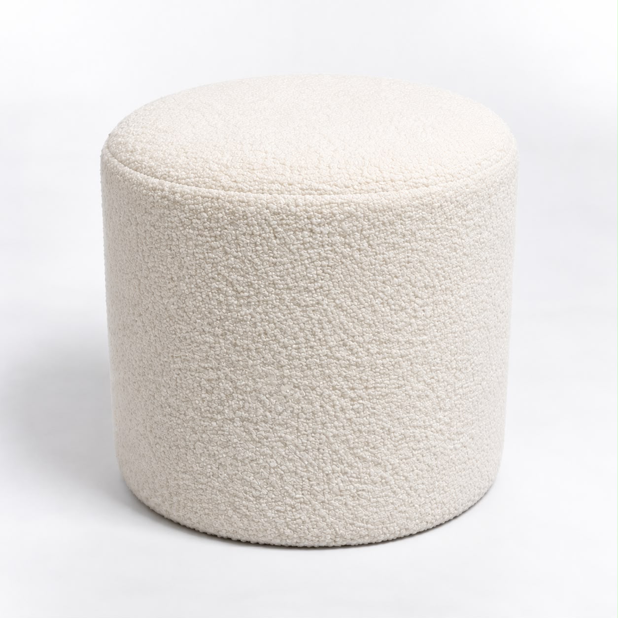 Arlo cream bouclé stool photographed on a plain background showing its round cylindrical shape and padded seat