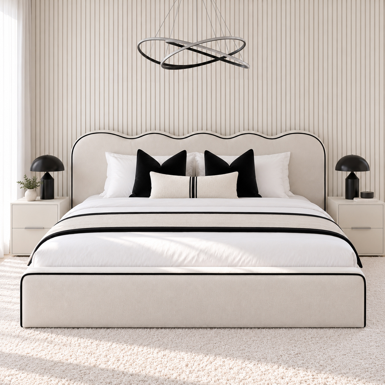 Castle scalloped bed viewed straight on, showing the wide wave headboard and the black piping around the low base